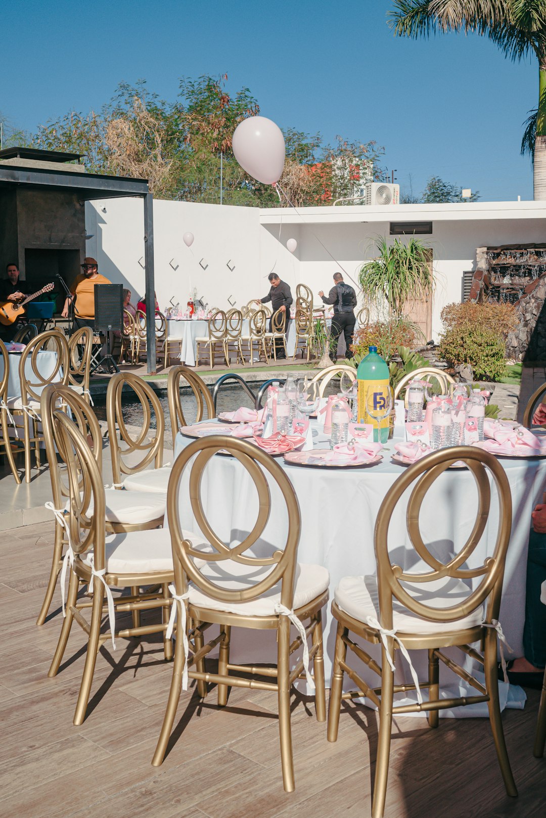 outdoor-tables-set-for-a-party-with-gold-chairs-fuocqrqn9ts